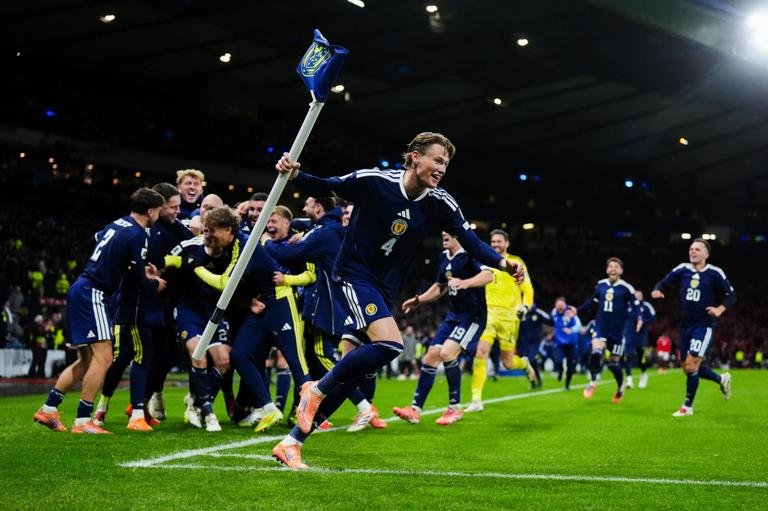 Scotland's Scott McTominay celebrates with team mates after their sides fourth goal scored by Kenny McLean during the FIFA World Cup European Qualifying match at Hampden Park, Glasgow. Picture date: Tuesday November 18, 2025. (Photo by Andrew Milligan/PA Images via Getty Images)
