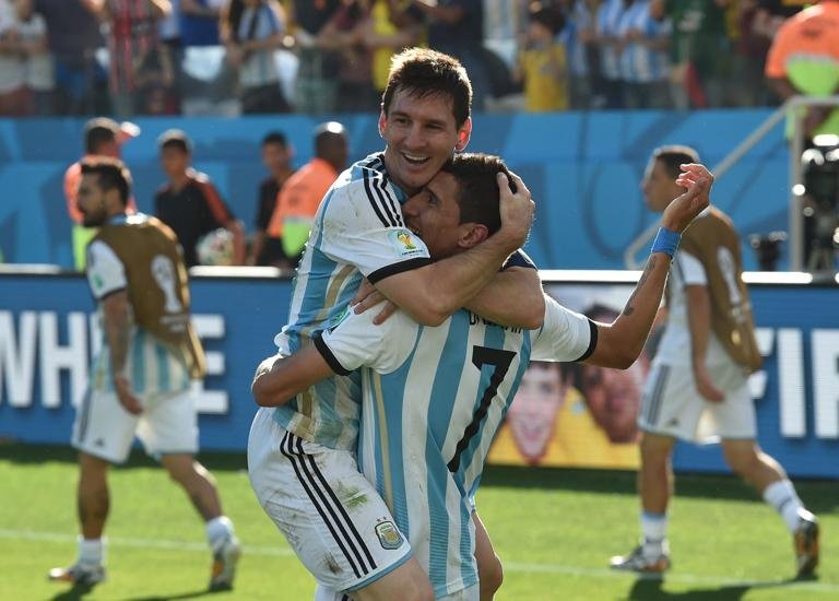 Argentina's forward and captain Lionel Messi (L) and Argentina's midfielder Angel Di Maria celebrate after scoring the 1-0 during a Round of 16 football match between Argentina and Switzerland at Corinthians Arena in Sao Paulo during the 2014 FIFA World Cup on July 1, 2014. AFP PHOTO / NELSON ALMEIDA (Photo credit should read NELSON ALMEIDA/AFP via Getty Images)