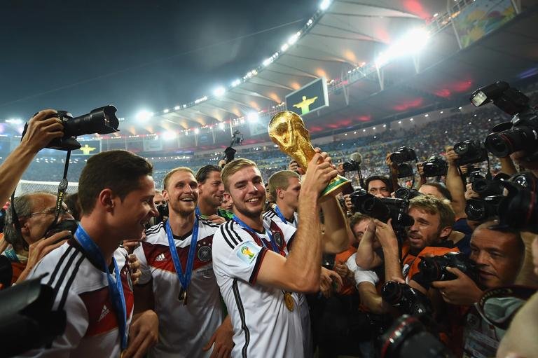 RIO DE JANEIRO, BRAZIL - JULY 13: Christoph Kramer of Germany celebrates with the World Cup trophy after defeating Argentina 1-0 in extra time during the 2014 FIFA World Cup Brazil Final match between Germany and Argentina at Maracana on July 13, 2014 in Rio de Janeiro, Brazil. (Photo by Laurence Griffiths/Getty Images)