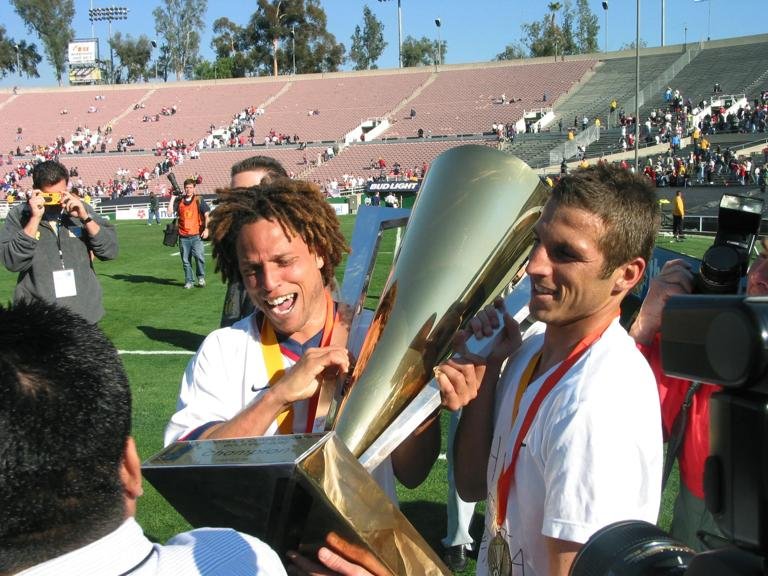 2 Feb 2002: Cobi Jones (l) and Frankie Hejduk of the USA tour the field with the first place trophy after their CONCACAF Gold Cup Championship match at the Rose Bowl in Pasadena, California. The USA defeated Costa Rica 2-0. DIGITAL IMAGE Mandatory Credit: Stephen Dunn/Allsport