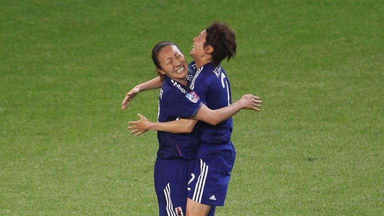 WOLFSBURG, GERMANY - JULY 09: Karina Maruyama (L) of Japan celebrates her first goal with her teammate Yukari Kinga during the FIFA Women's World Cup quarter finals match between Germany and Japan on July 9, 2011 in Wolfsburg, Germany. (Photo by Alexandra Beier - FIFA/FIFA via Getty Images)