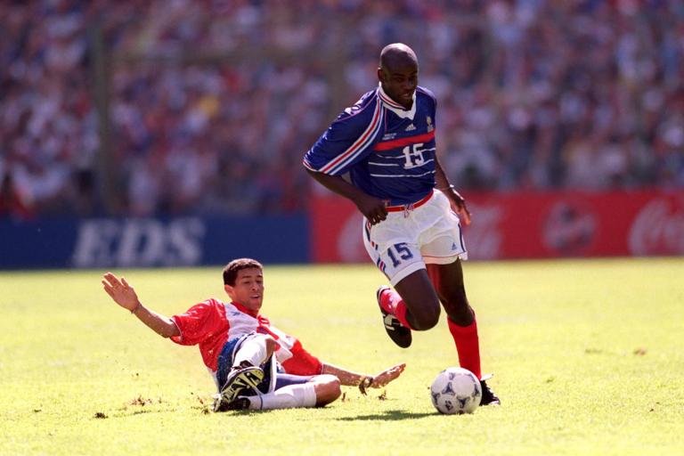 France's Lilian Thuram (right) gets away from the tackle of Paraguay's Jorge Campos (left) (Photo by Michael Steele/EMPICS via Getty Images)